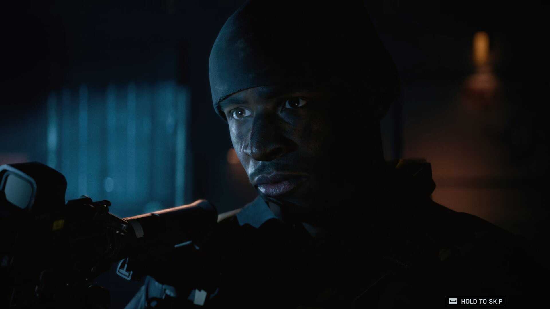 Battlefield 6 screenshot showing Dylan stood in the dark aiming a gun