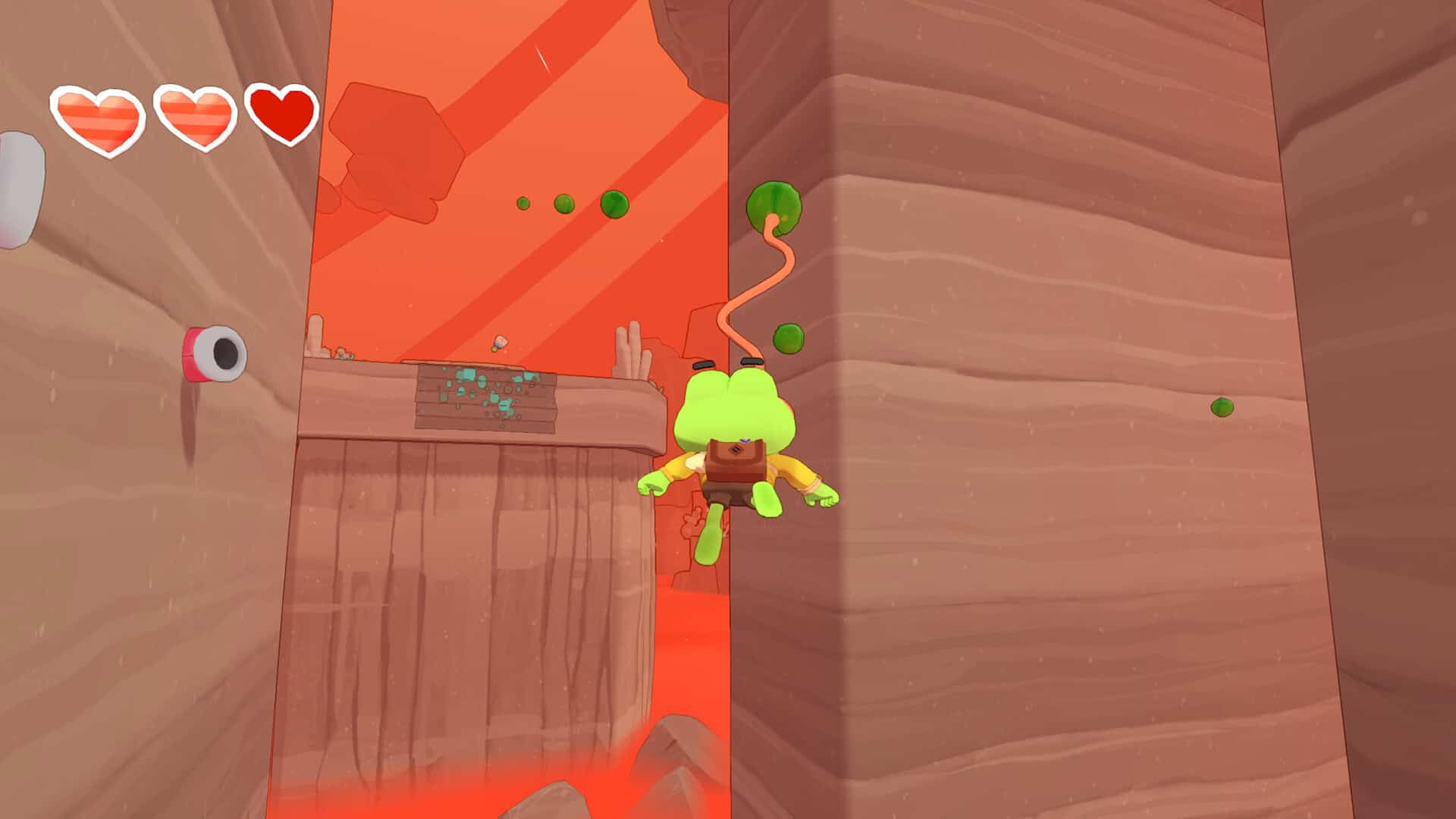 A frog uses its tongue to platform and stick to walls.