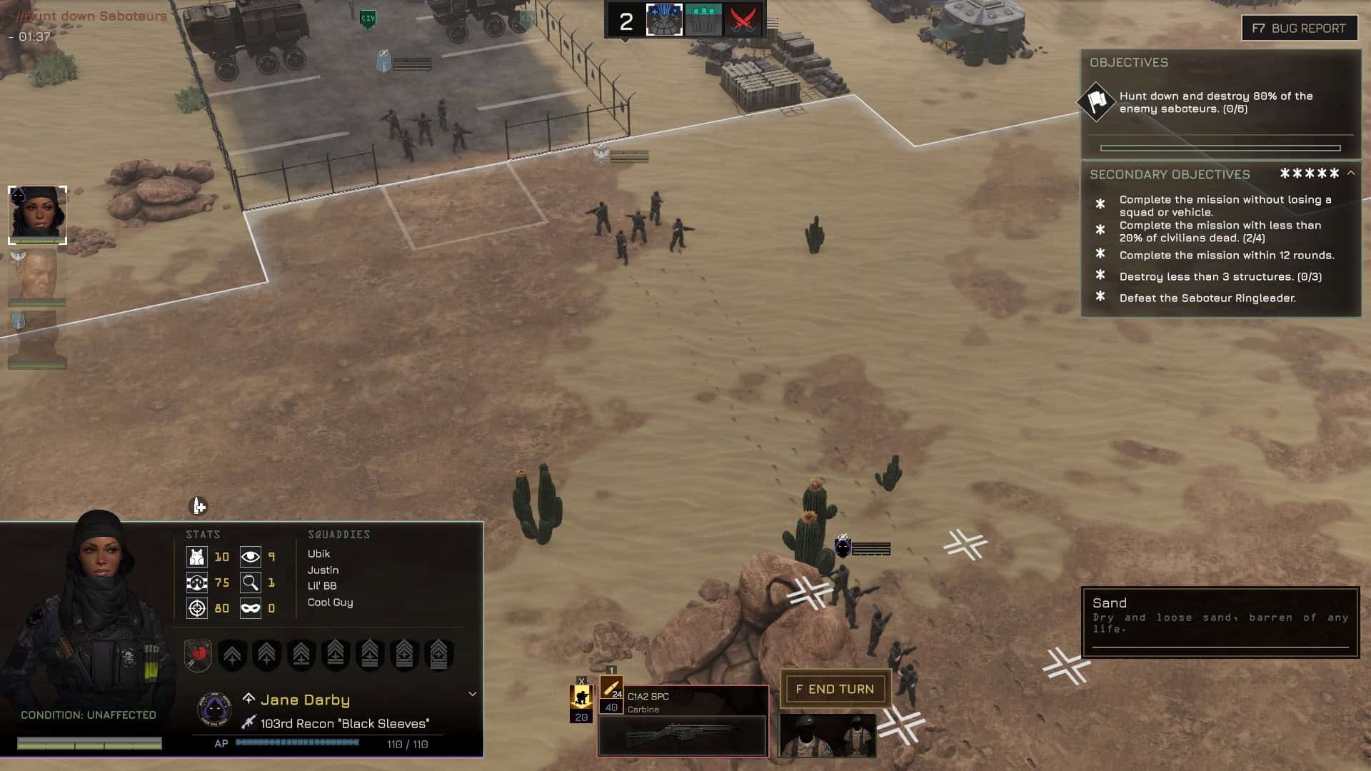 Military units deployed in a desert environment on the outskirts of a settlement