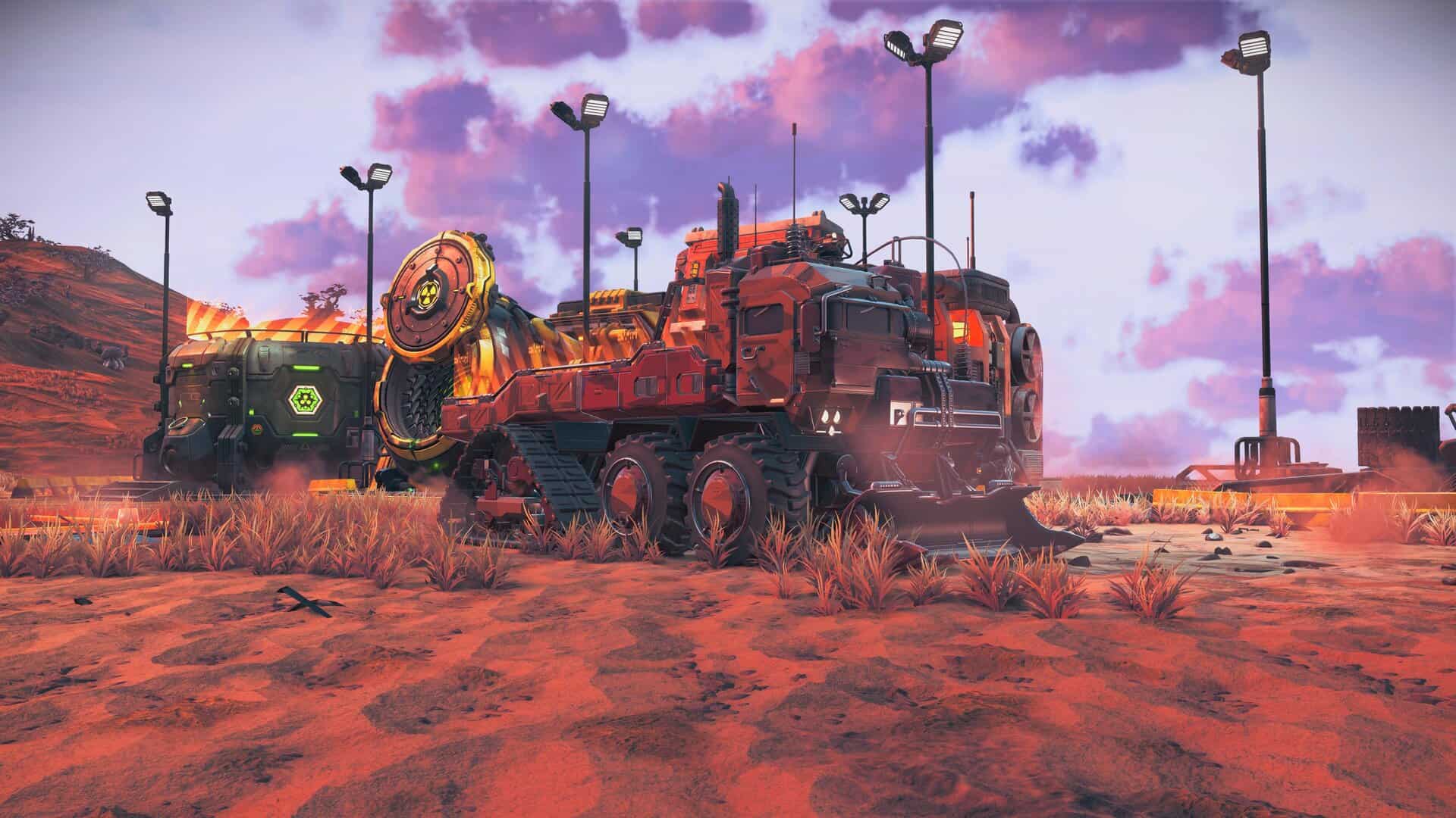 A flatbed truck with a bulldozer blade in front of facilities with biohazard and radiation warning logos