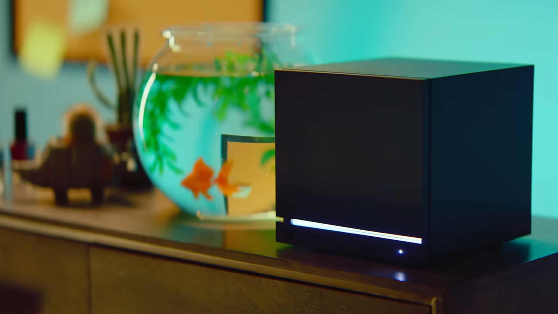 Steam Machine next to a goldfish tank on a table