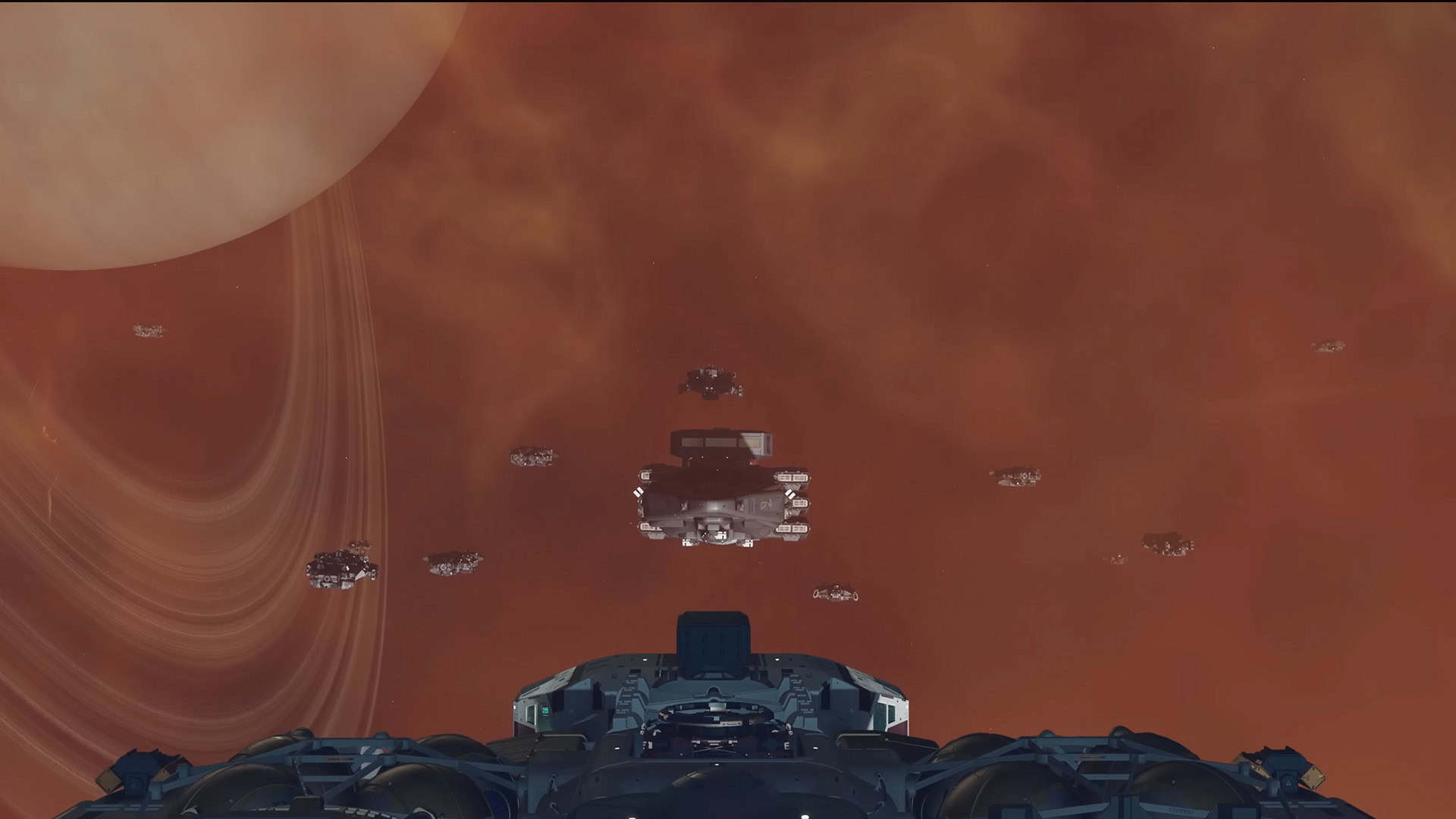 Starfield Terran Armada DLC screenshot showing a fleet of space ships in front of the player's ship around a ringed planet