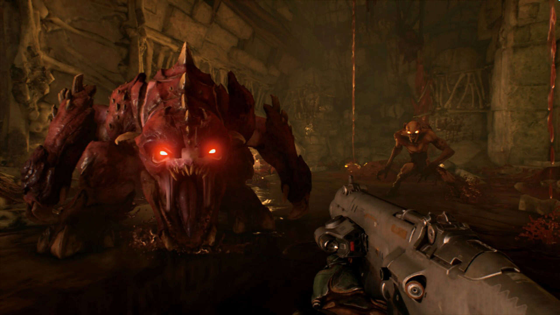 Screenshot of Doom 2016 on the Switch 1, gun aimed at a demon with open mouth