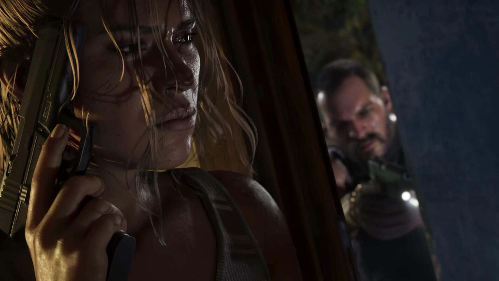 GTA 6 screenshot of one of the characters hiding from a gunman