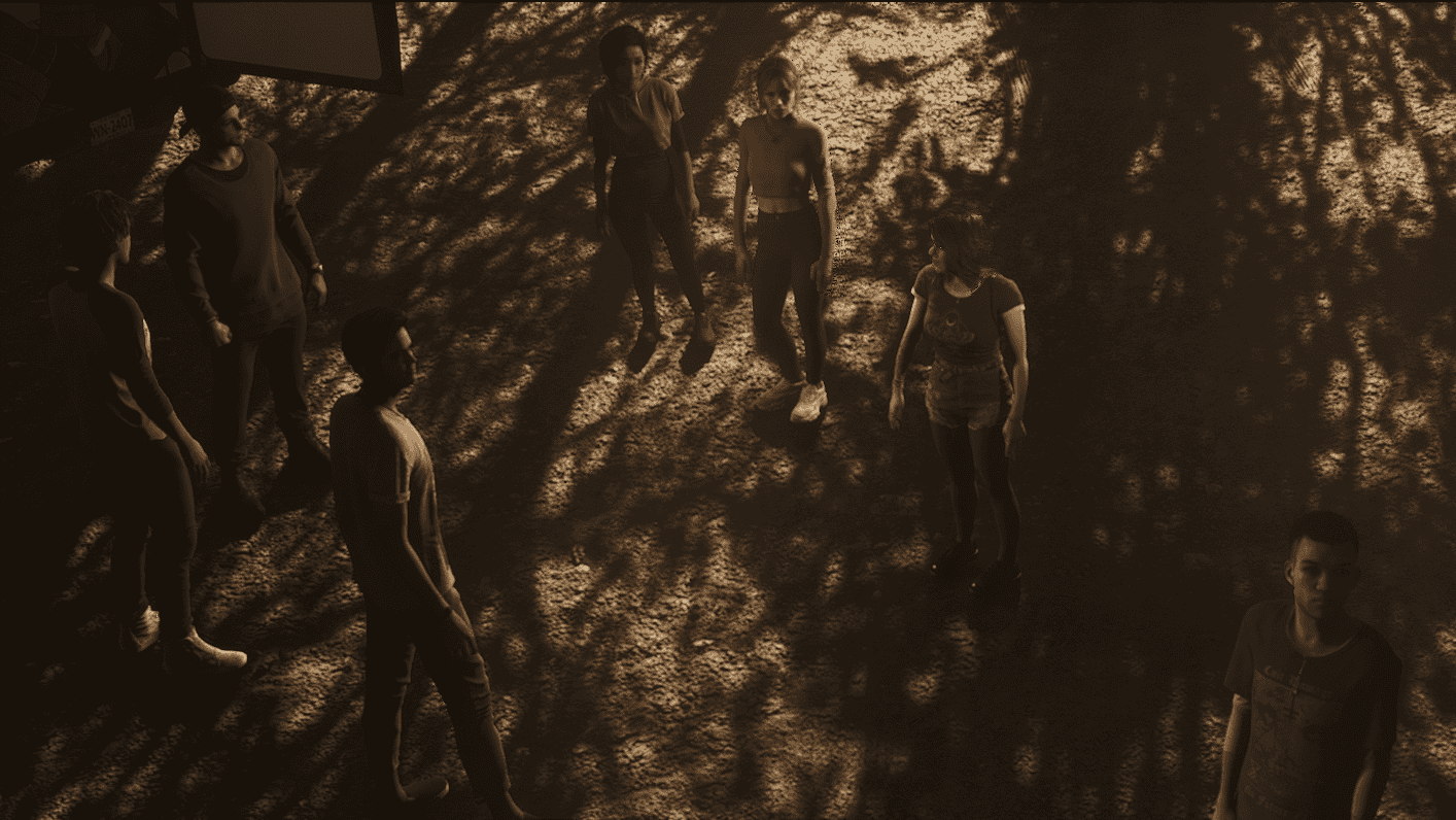 Seven young people gather around in an outdoor environment - Screenshot from The Quarry