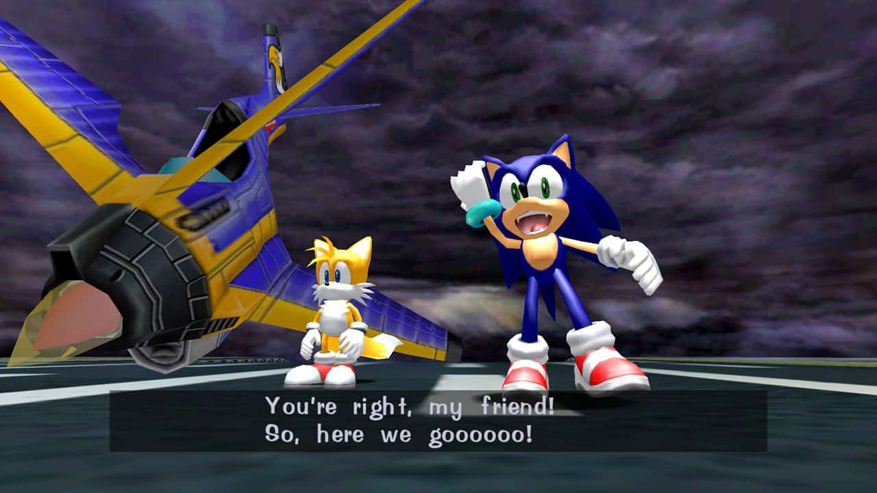 Sonic Adventure 1 screenshot of Sonic and Tails standing next to an airplane. Sonic says "You're right, my friend! So, here we goooo!" The characters are very shiny.