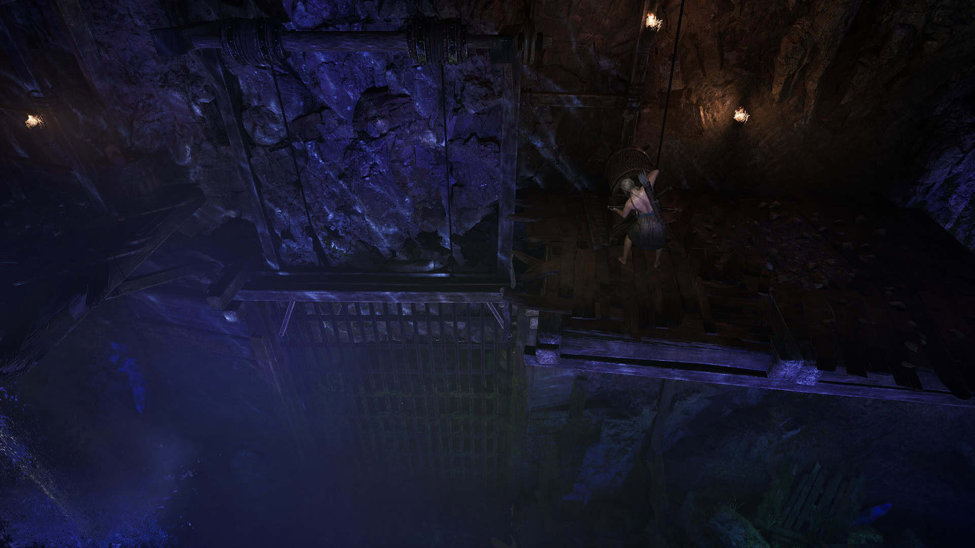 The protagonist cranking open a a gate