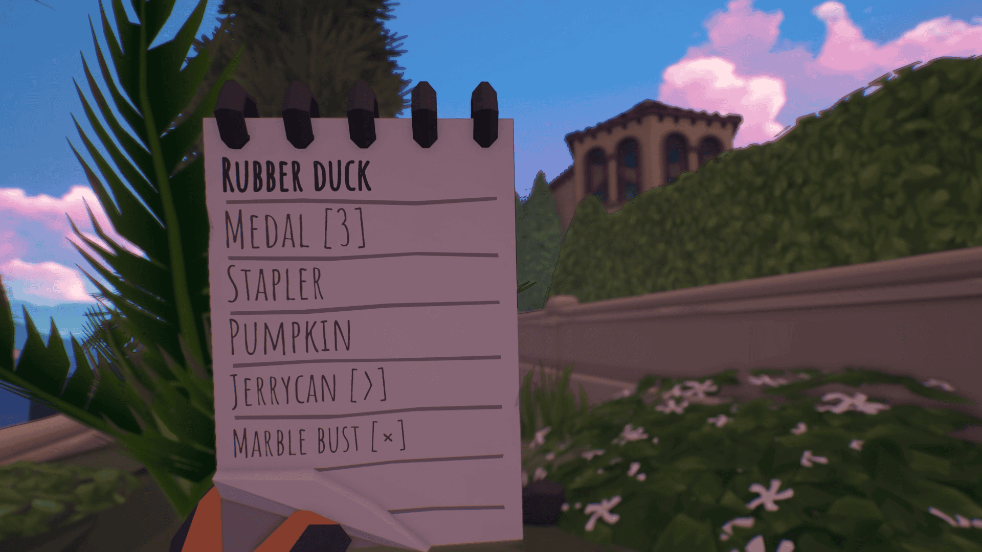 A POV shot of a white spiral notepad showing a list of items incliding rubber duck, medal (3), stapler, pumpkin, and jerrycan. In the background are a row of hedges against a white concrete wall beyond which are more hedges and just visible above the hedges is the roof of a house. 
