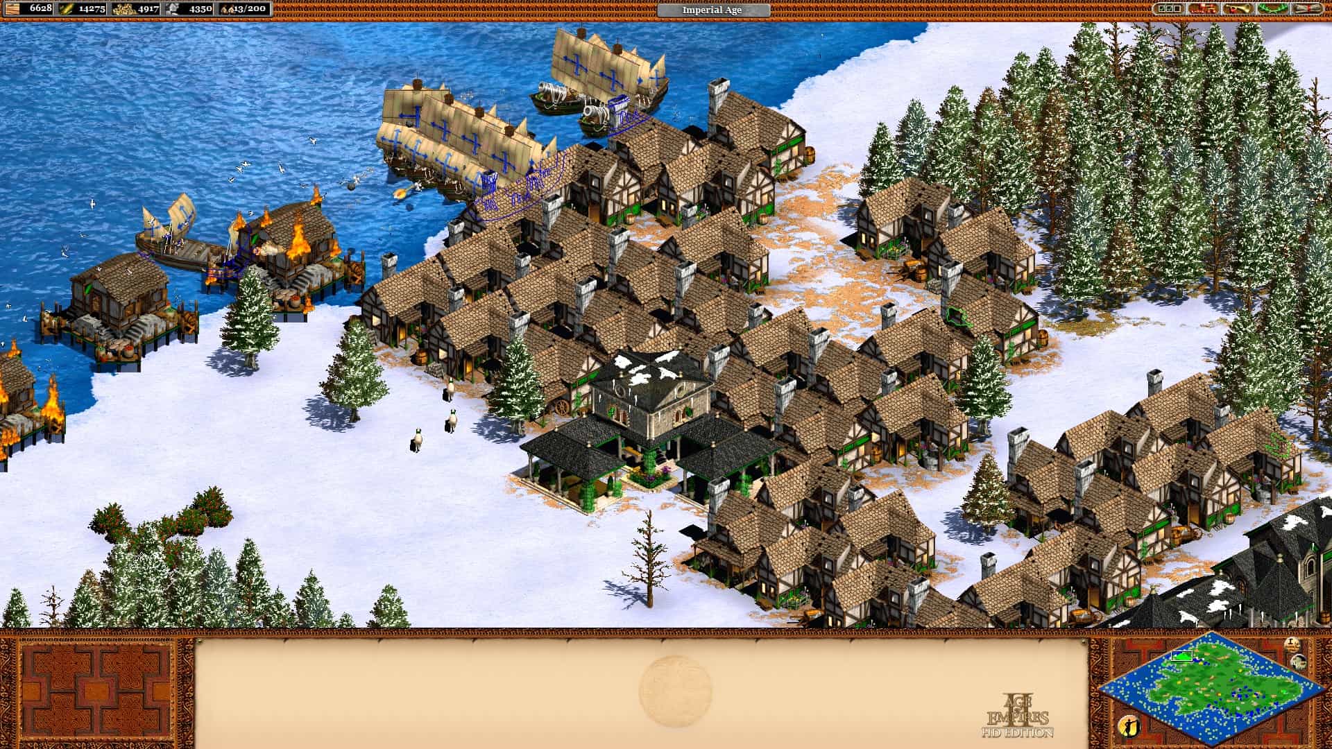 A screenshot from Age of Empires II showing a snow-covered map and a few rows of houses.