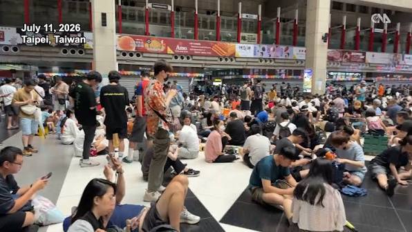A picture of refugees in Taiwan on their phones