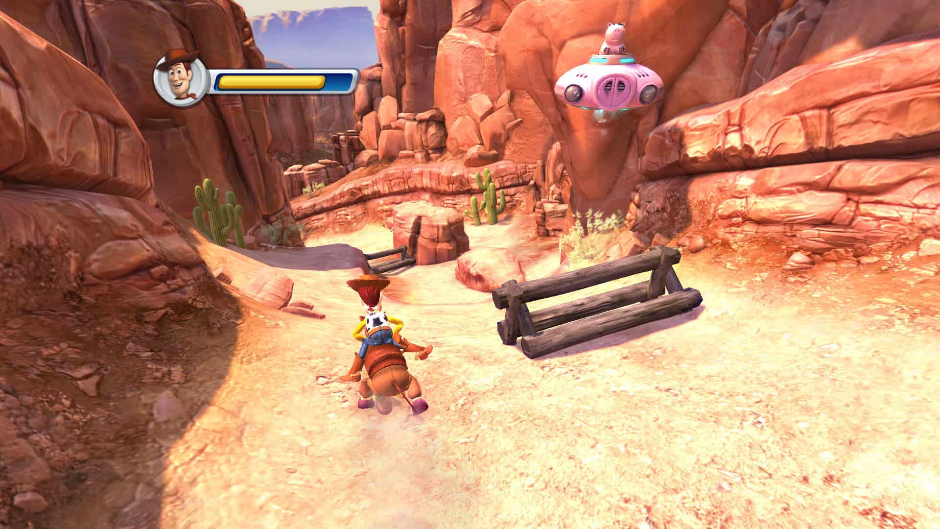 Woody riding on Bullseye towards Ham in a pink UFO