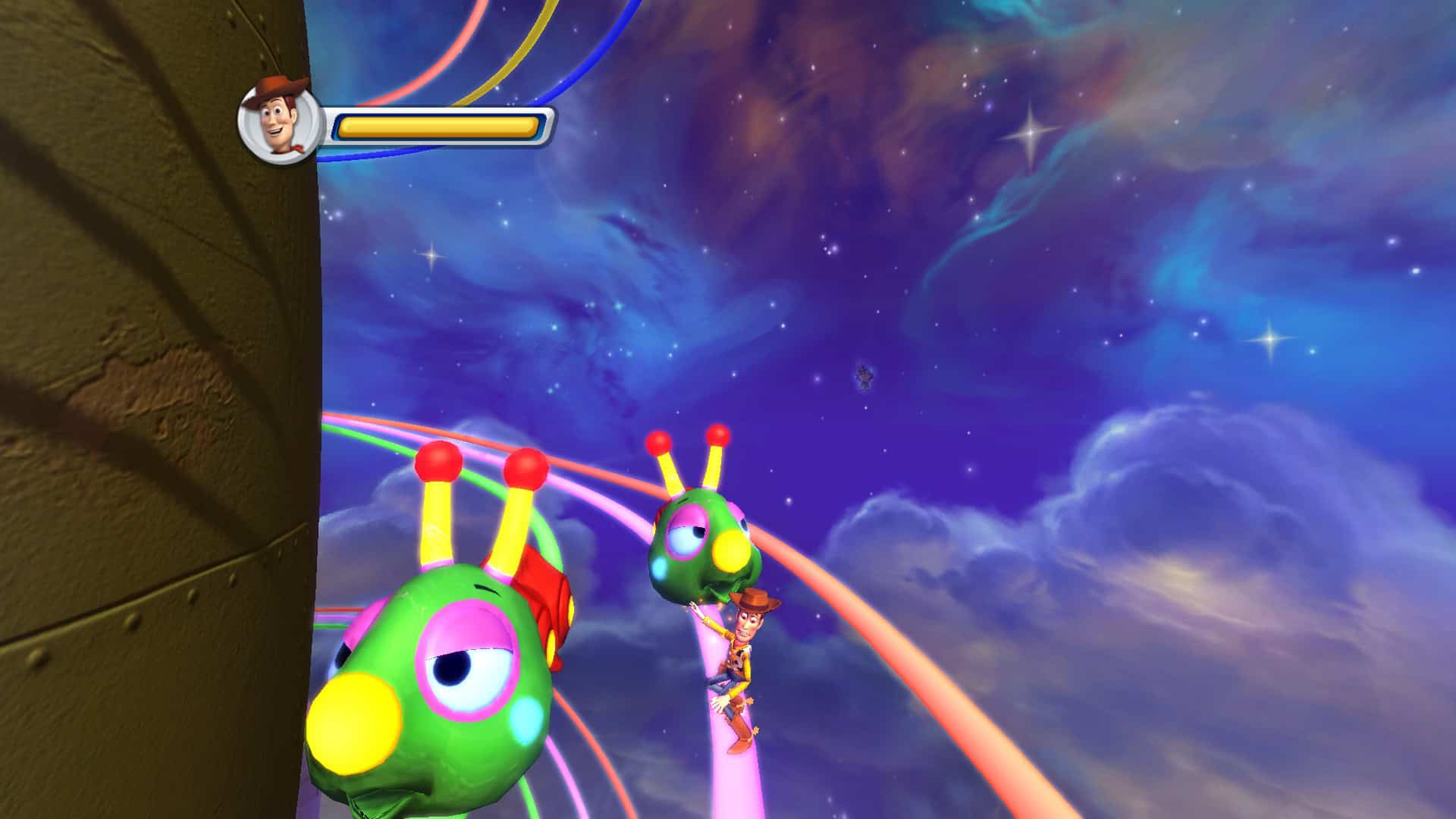 Woody riding on rails as colorful caterpillars chase him